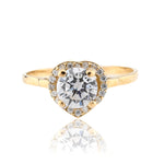 Gold ring with a large diamond and smaller diamonds around on a white background