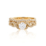 Gold ring with a diamond on a white background