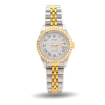Two-tone silver and gold watch with a white face on a white background