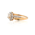 Gold ring with a diamond on a white background