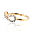 Gold ring with diamond accents on a white background