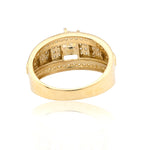 Gold ring with diamond accents on a white background