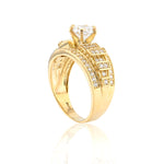 Gold ring with diamond accents on a white background
