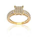 Gold ring with diamond accents on a white background