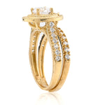 Gold ring with diamond accents on a white background