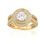 Gold ring with a large diamond and smaller diamonds on a white background