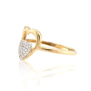 Gold ring with heart design and embedded diamonds on a white background