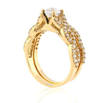 Gold ring with diamond accents on a white background