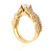 Gold ring with diamond accents on a white background
