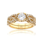 Gold ring with a diamond on a white background