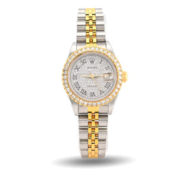 Two-tone silver and gold watch with a white face on a white background