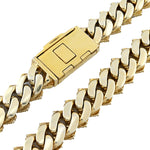 yellow gold Miami Cuban link chain featuring a solid box clasp and pavé diamond detailing along the side profile of the links by SB Jewelers.