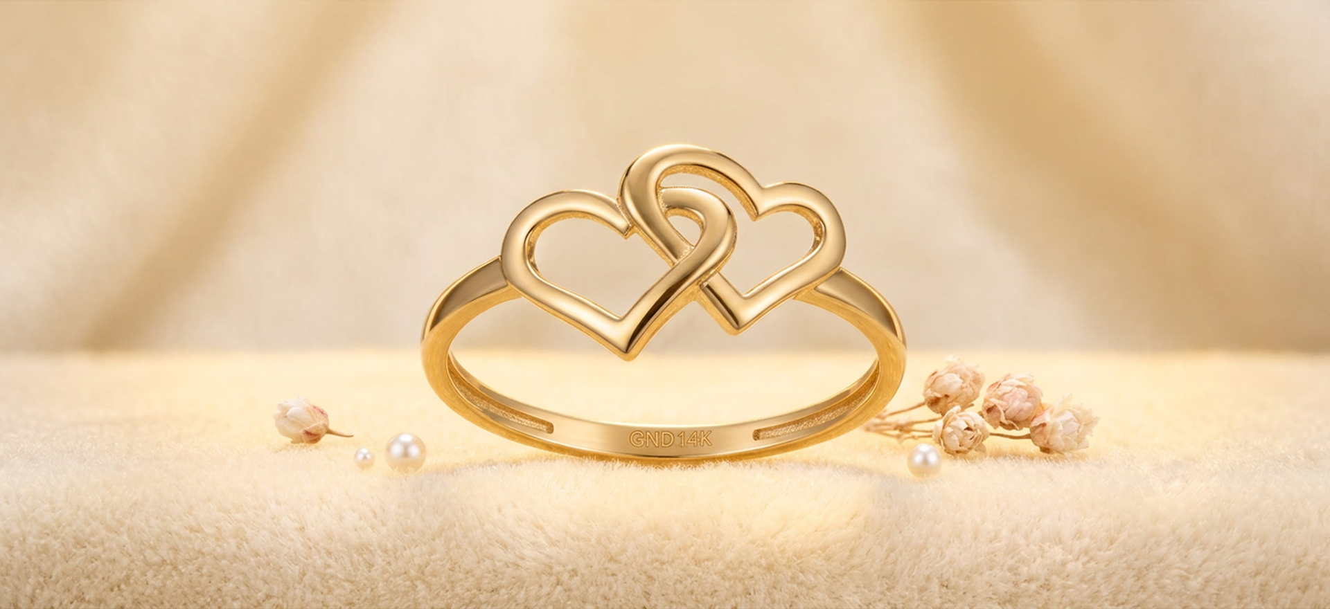 Custom 14K gold heart ring by SB Custom Jewelers featuring an elegant double heart design crafted with modern luxury and timeless style.