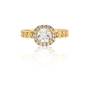 Gold ring with a diamond on a white background