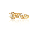 Gold ring with a diamond on a white background