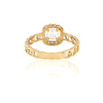 Gold ring with a diamond on a white background