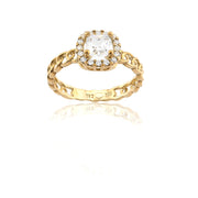 Gold ring with a diamond on a white background