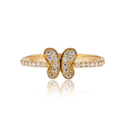 Gold butterfly ring with diamond accents on a white background