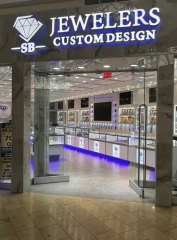 Jeweler's Custom Design store entrance with illuminated sign