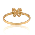 Gold butterfly ring on a white background