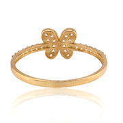 Gold butterfly ring on a white background