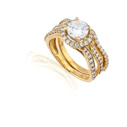 Gold ring with a large diamond and smaller diamonds on a white background