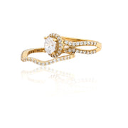 Gold ring with a diamond on a white background