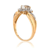 Gold ring with a diamond on a white background