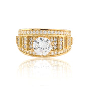 Gold ring with a large diamond and smaller diamonds on a white background