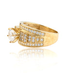 Gold ring with diamond accents on a white background
