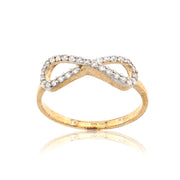 Gold infinity ring with diamonds on a white background