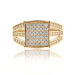 Gold ring with diamond accents on a white background