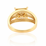 Gold ring with diamond accents on a white background