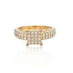 Gold ring with diamond accents on a white background