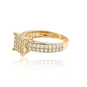 Gold ring with diamond accents on a white background