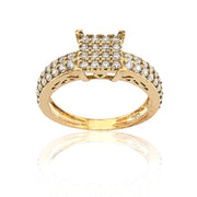 Gold ring with diamond accents on a white background