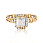 Gold ring with a large diamond and smaller diamonds on a white background