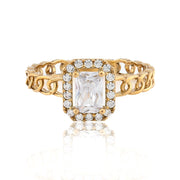 Gold ring with a large diamond and smaller diamonds on a white background