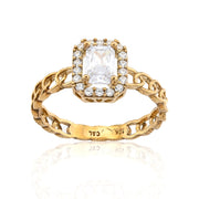 Gold ring with a diamond on a white background