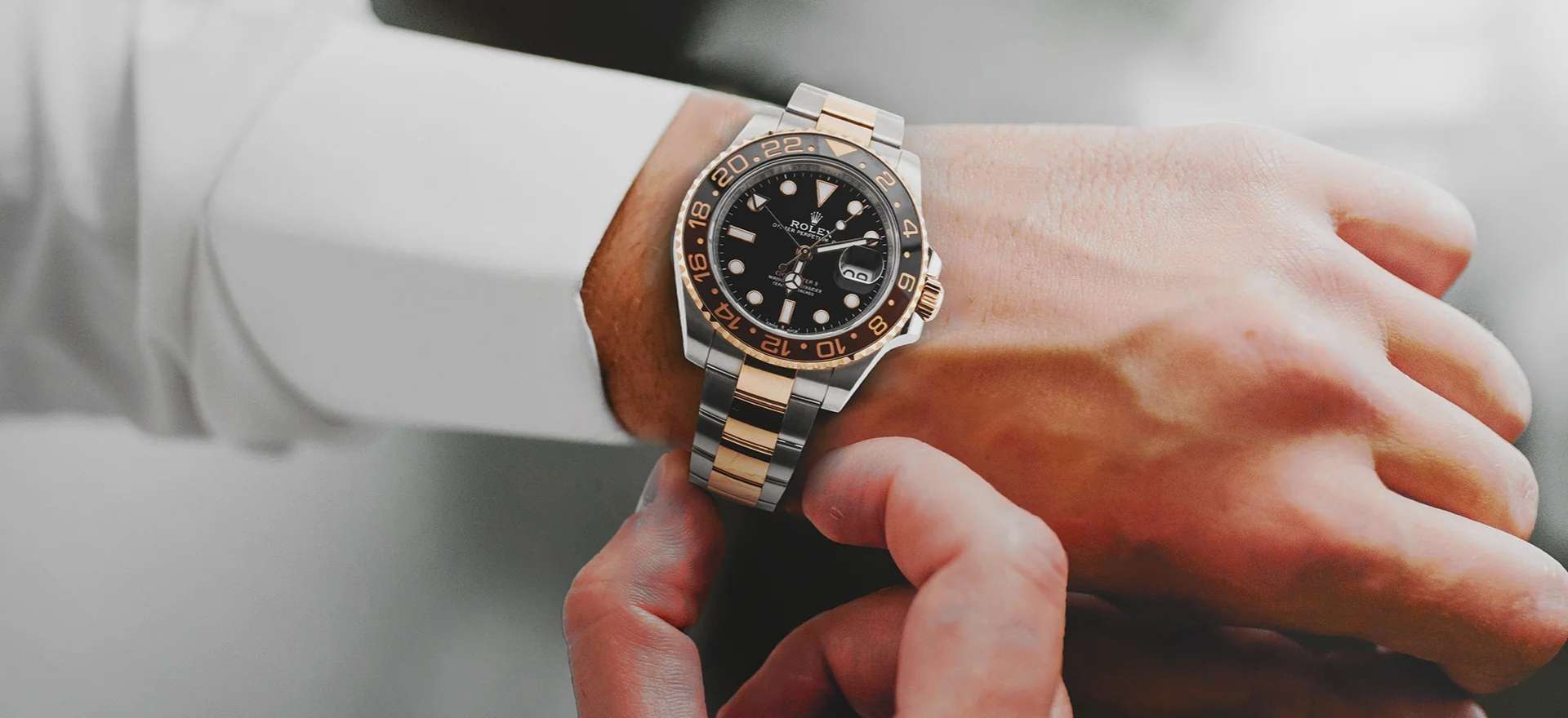 Close-up of a two-tone Rolex 126711CHNR with a 40mm case, black dial with luminous markers, and a signature bi-color Cerachrom bezel.